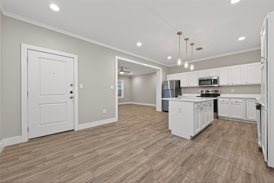 6605 Greenhurst Street Houston, TX 77091 - Photo 12 of 41 a view of kitchen with granite countertop cabinets and refrigerator