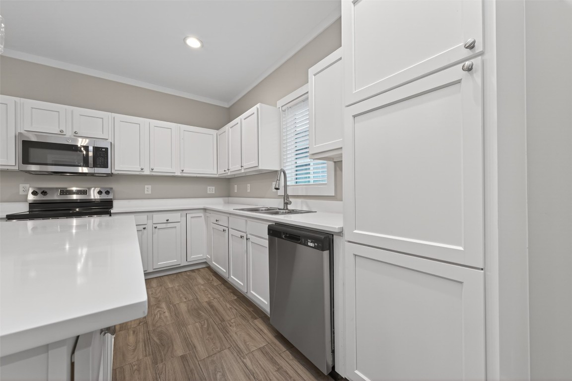 6605 Greenhurst Street Houston, TX 77091 - Photo 13 of 41 a kitchen with stainless steel appliances a refrigerator sink and microwave