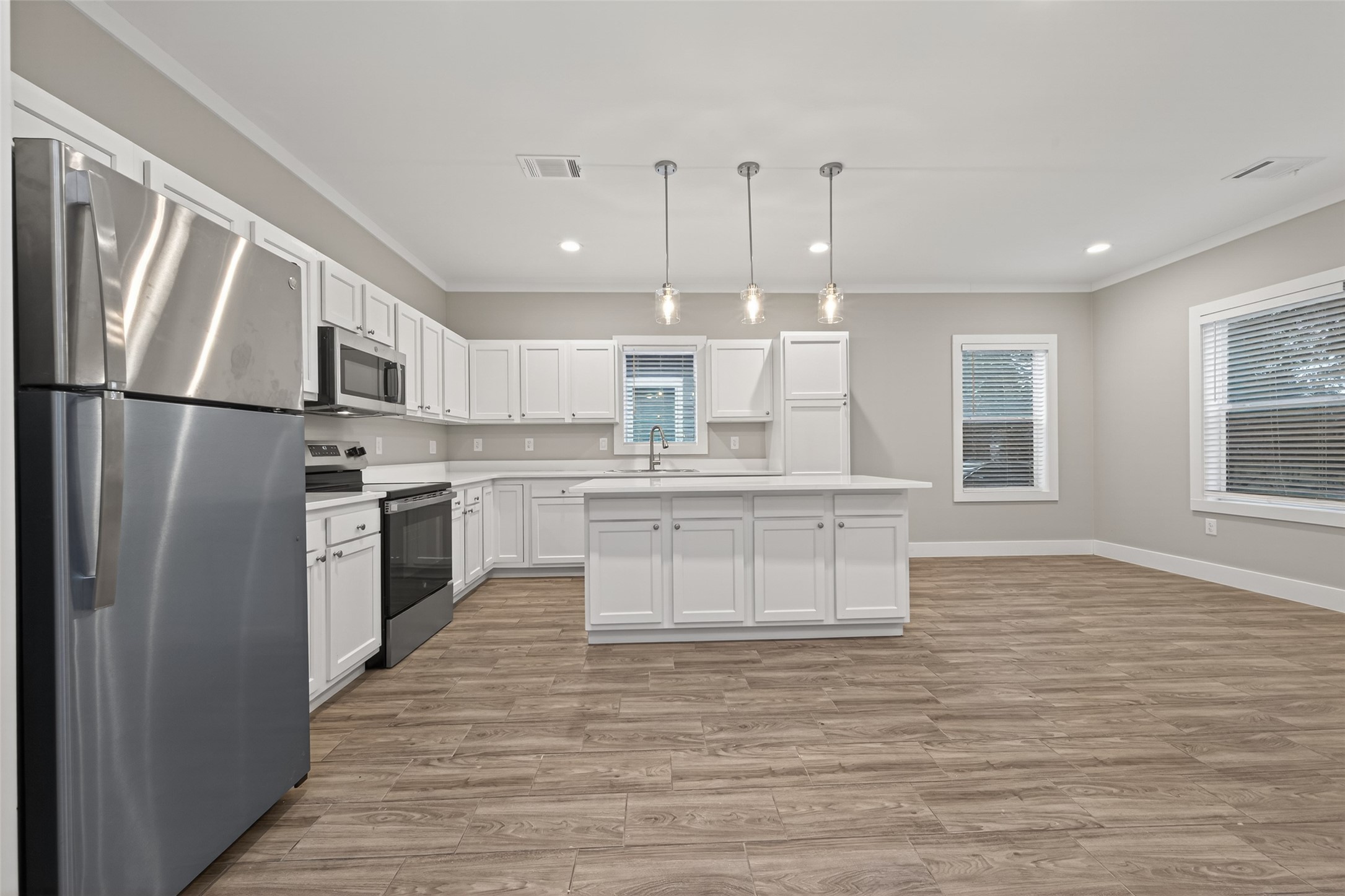 6605 Greenhurst Street Houston, TX 77091 - Photo 15 of 41 a kitchen with stainless steel appliances a refrigerator sink and cabinets