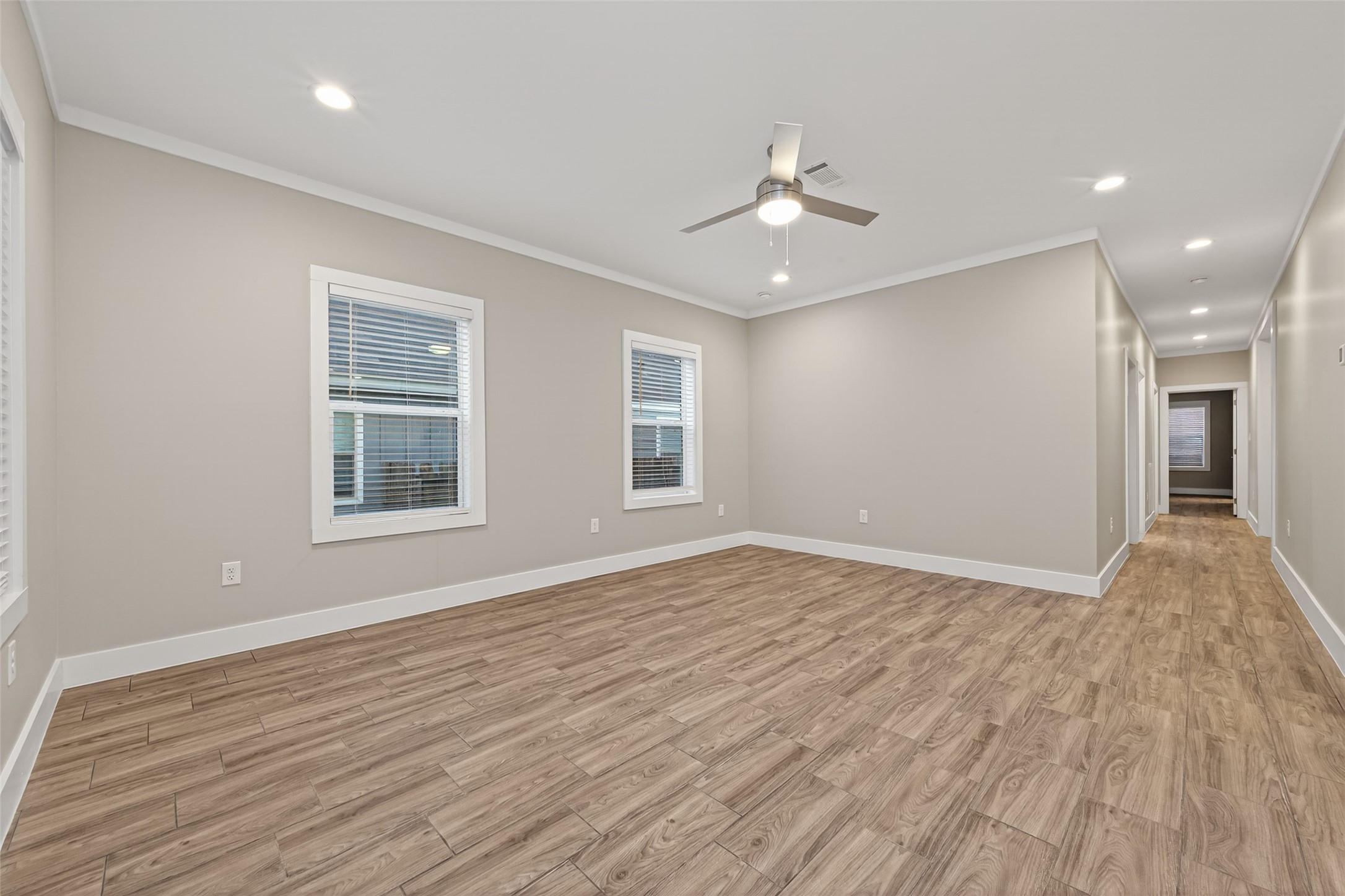 6605 Greenhurst Street Houston, TX 77091 - Photo 16 of 41 a view of an empty room with wooden floor and a window