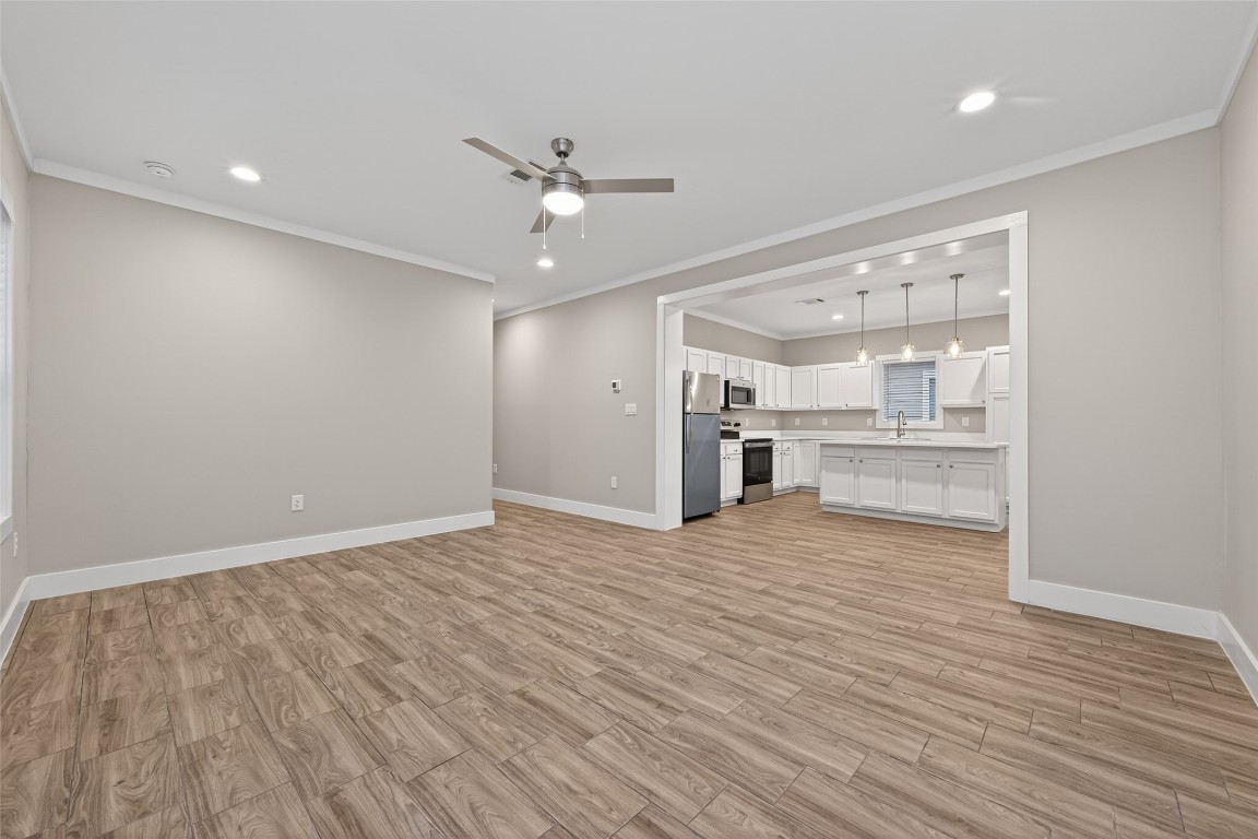 6605 Greenhurst Street Houston, TX 77091 - Photo 17 of 41 a view of empty room with wooden floor and window