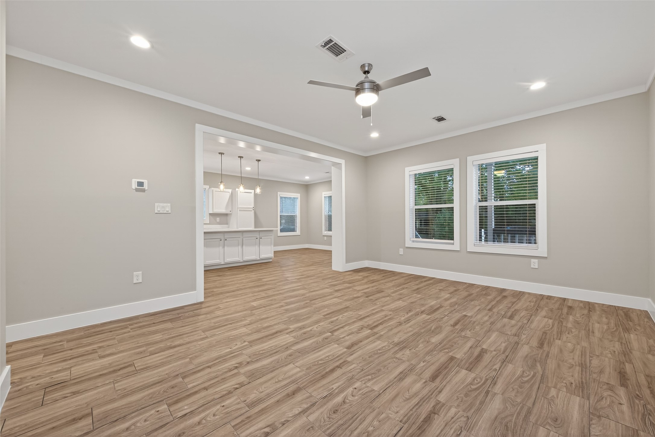 6605 Greenhurst Street Houston, TX 77091 - Photo 18 of 41 a view of an empty room with a window and wooden floor