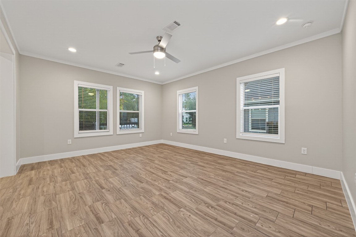 6605 Greenhurst Street Houston, TX 77091 - Photo 19 of 41 a view of an empty room with wooden floor and a window