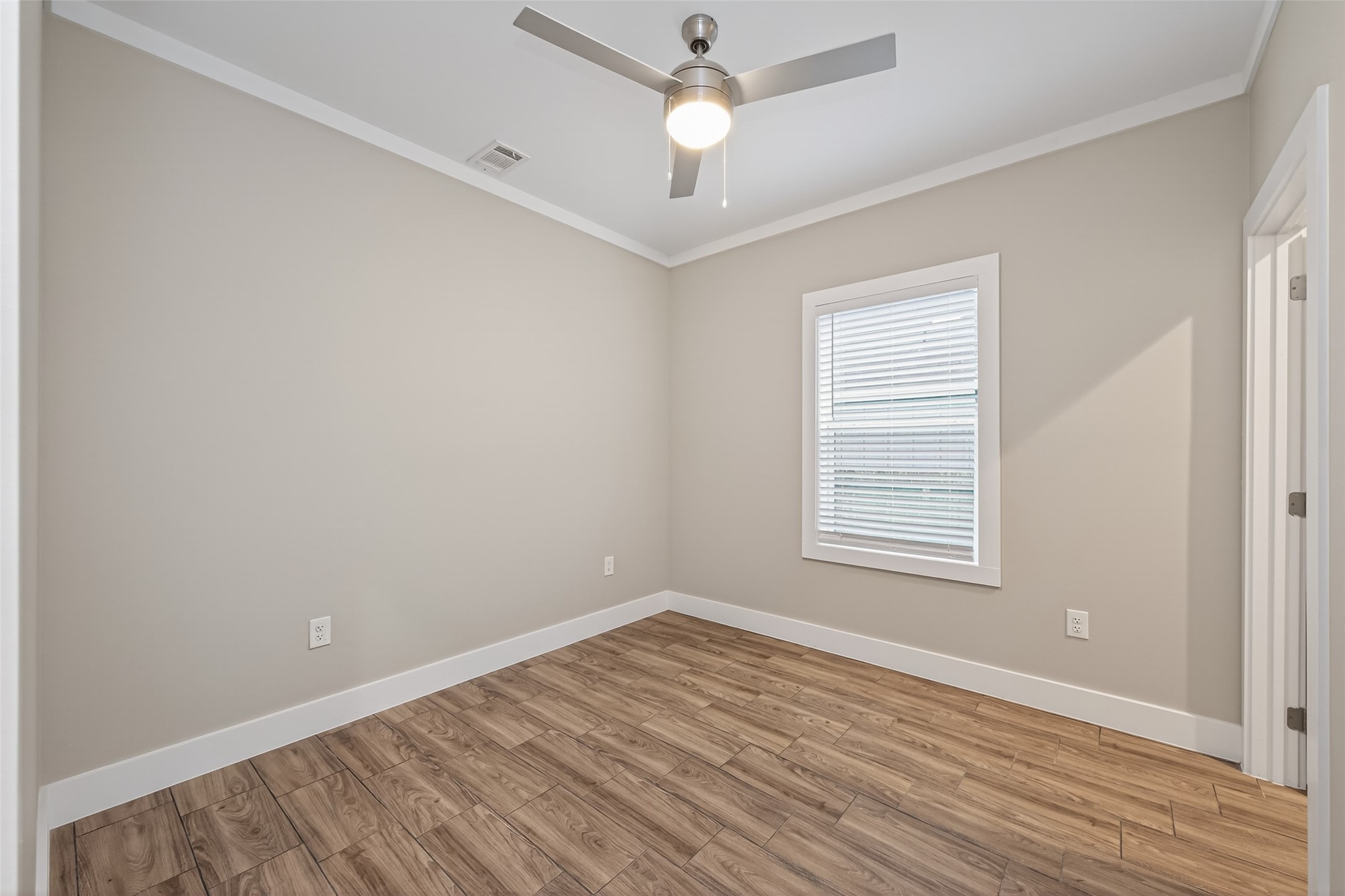 6605 Greenhurst Street Houston, TX 77091 - Photo 20 of 41 wooden floor in an empty room with a window
