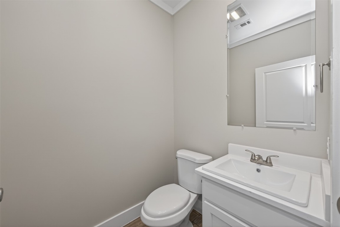 6605 Greenhurst Street Houston, TX 77091 - Photo 22 of 41 a white toilet sitting next to a bathroom sink