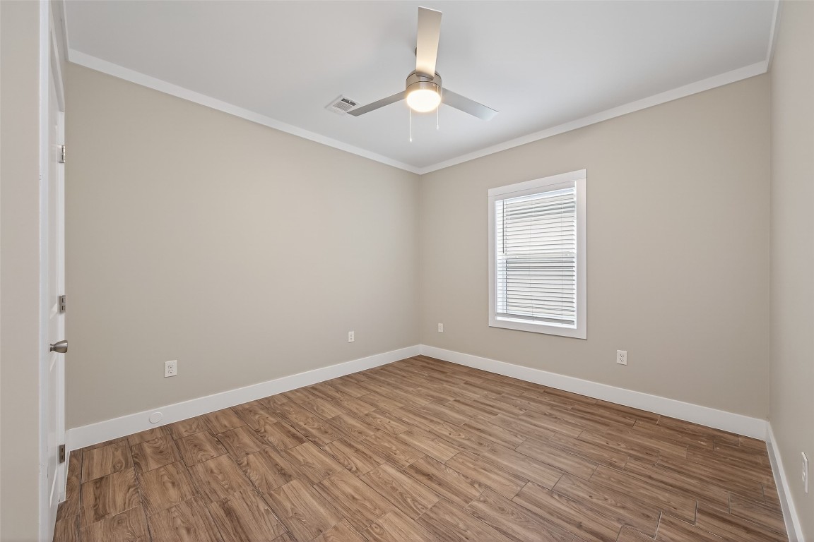 6605 Greenhurst Street Houston, TX 77091 - Photo 23 of 41 a view of an empty room with wooden floor and a window