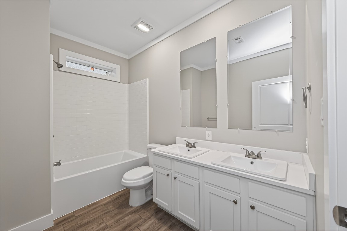 6605 Greenhurst Street Houston, TX 77091 - Photo 24 of 41 a bathroom with a double vanity sink and a bathtub