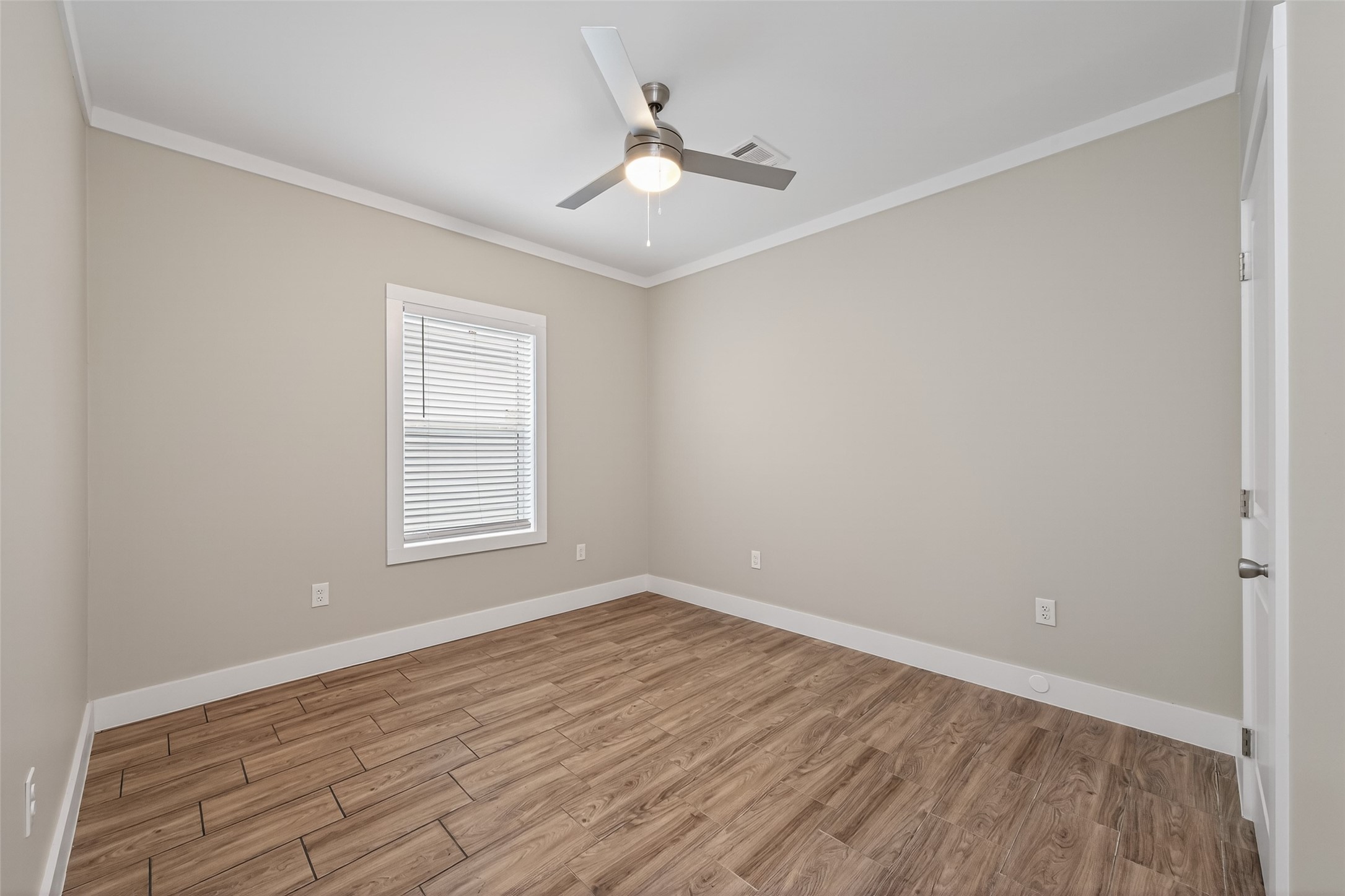 6605 Greenhurst Street Houston, TX 77091 - Photo 25 of 41 wooden floor in an empty room with a window