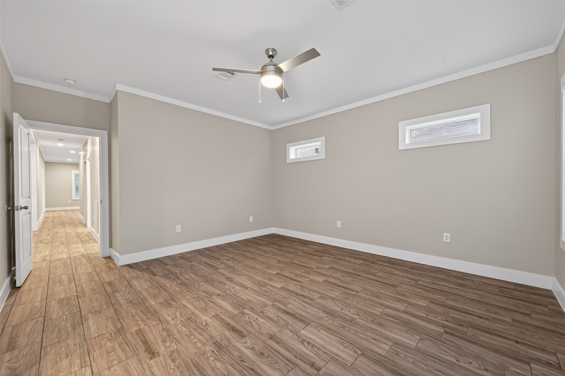 6605 Greenhurst Street Houston, TX 77091 - Photo 29 of 41 a view of an empty room with wooden floor
