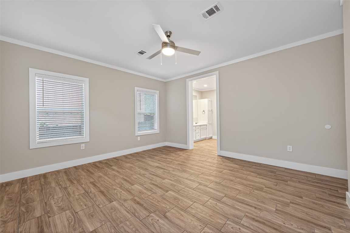 6605 Greenhurst Street Houston, TX 77091 - Photo 30 of 41 a view of an empty room with wooden floor and a window