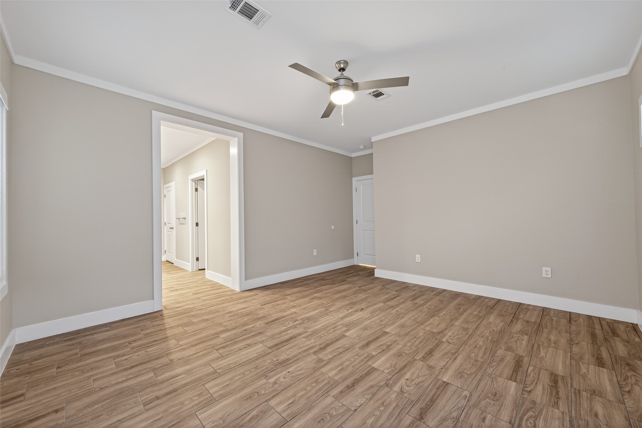 6605 Greenhurst Street Houston, TX 77091 - Photo 31 of 41 a view of an empty room with wooden floor