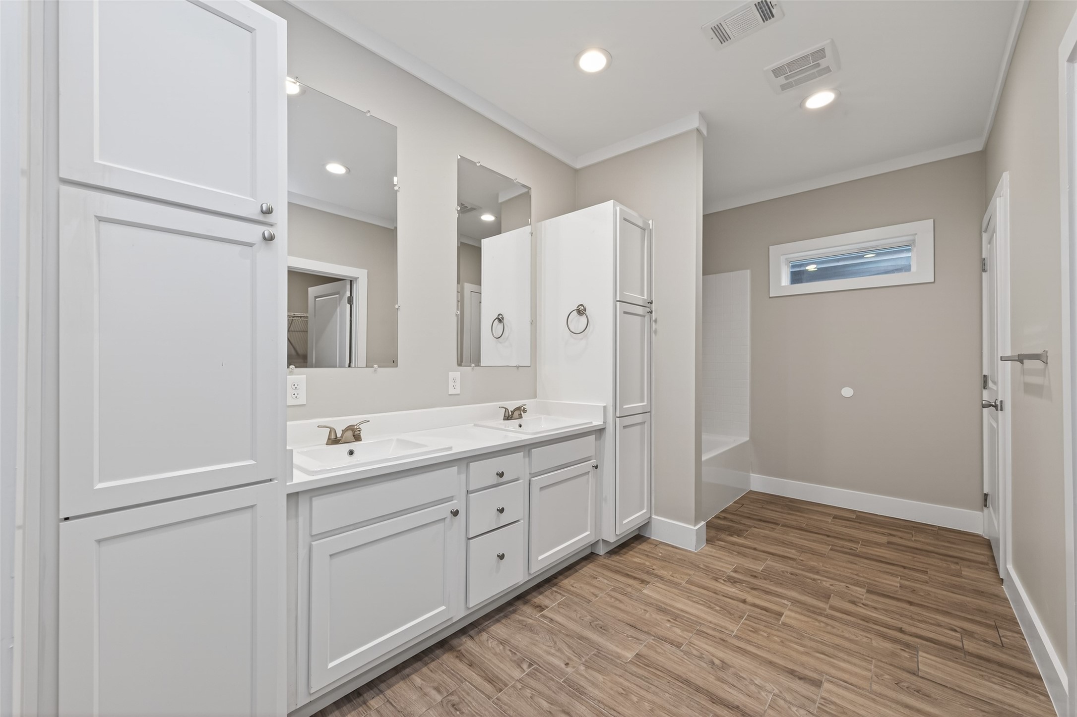 6605 Greenhurst Street Houston, TX 77091 - Photo 32 of 41 a spacious bathroom with a double vanity sink a mirror and a shower