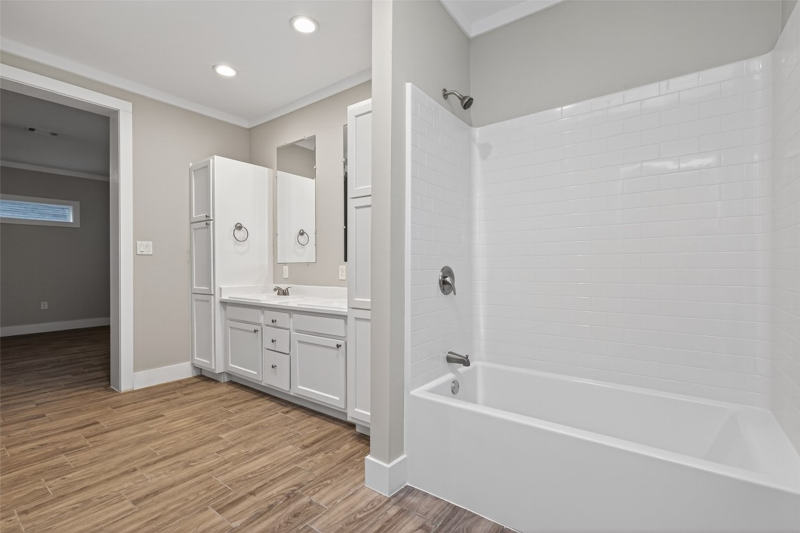 6605 Greenhurst Street Houston, TX 77091 - Photo 37 of 41 a bathroom with a tub sink shower and two mirror