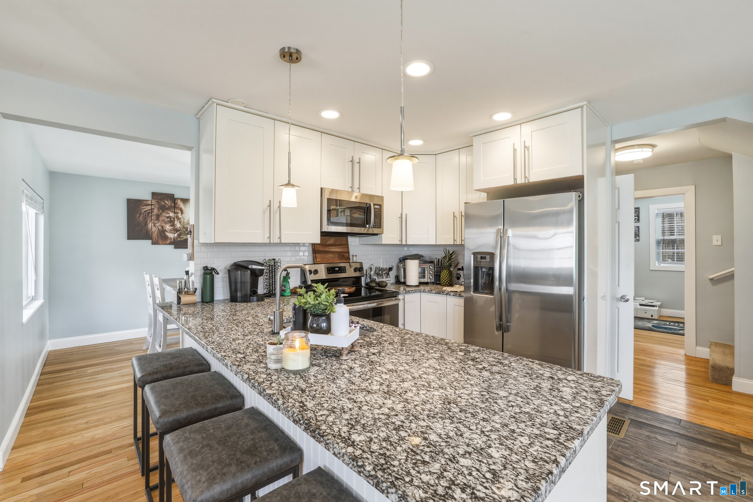 15 Cedar Avenue Wolcott, CT 06716 - Photo 7 of 31 a kitchen with stainless steel appliances granite countertop a refrigerator sink and stove