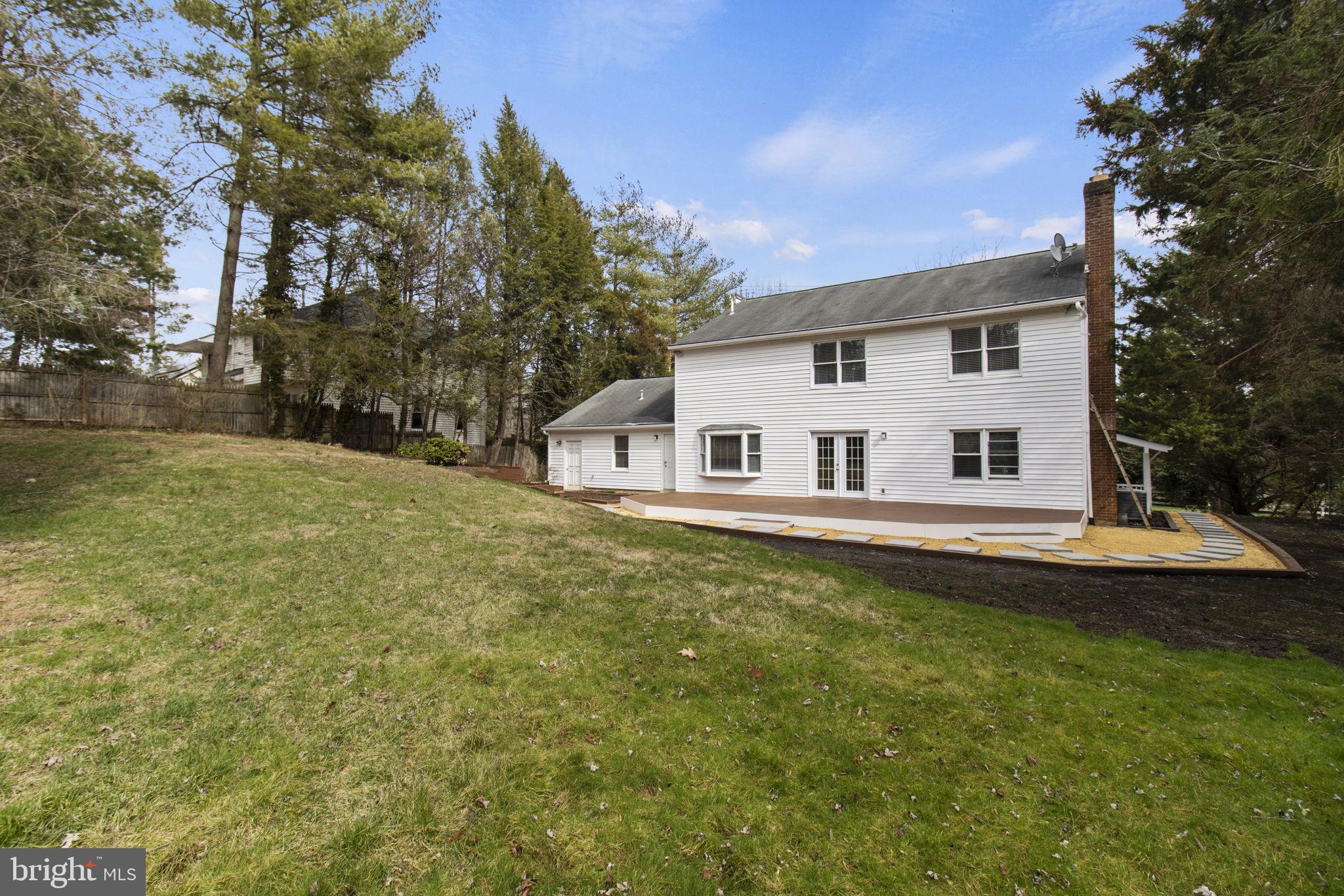 8800 Seven Locks Road Bethesda, MD 20817 - Photo 28 of 33 a front view of a house with a garden
