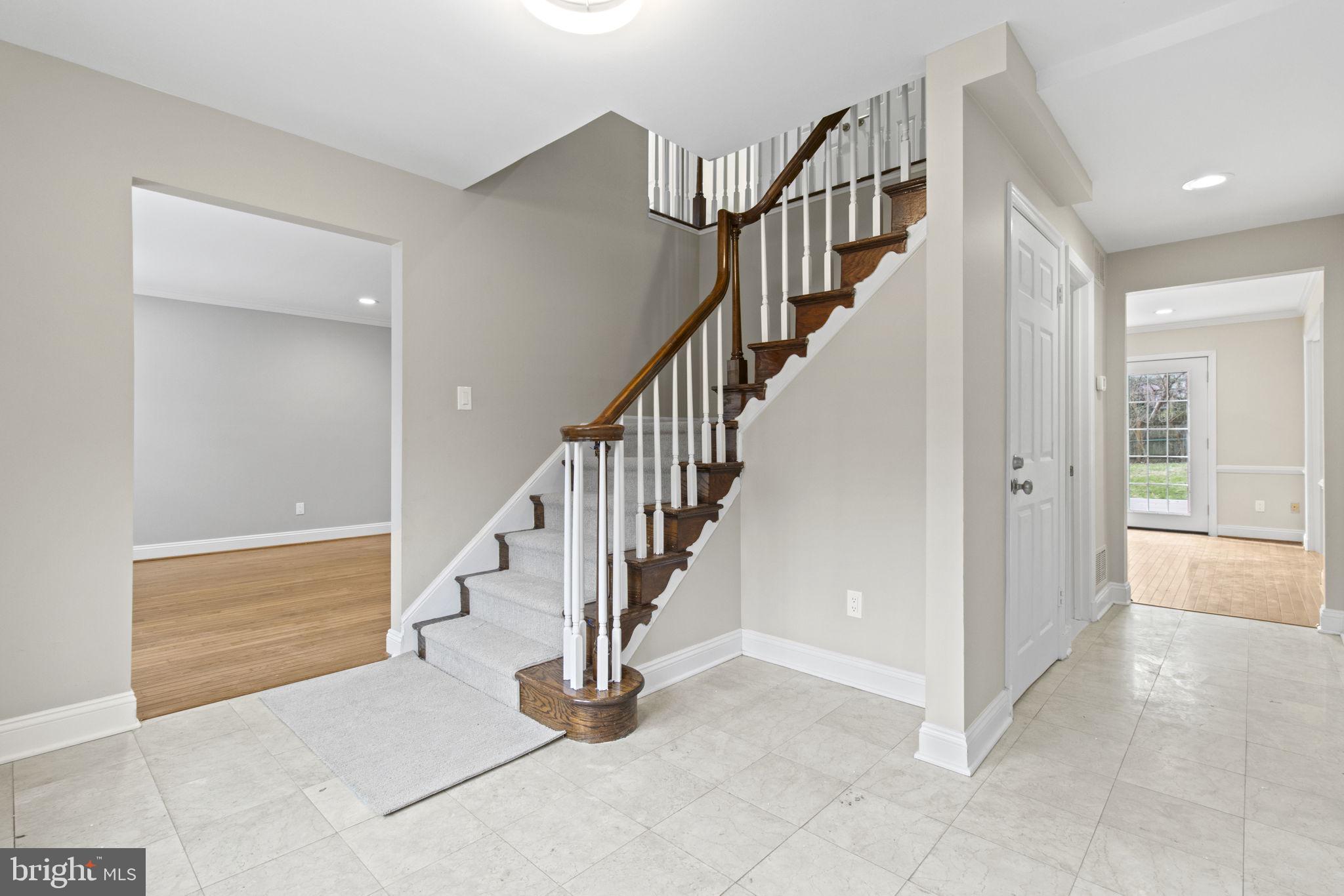 8800 Seven Locks Road Bethesda, MD 20817 - Photo 3 of 33 a view of entryway and hall with a living room