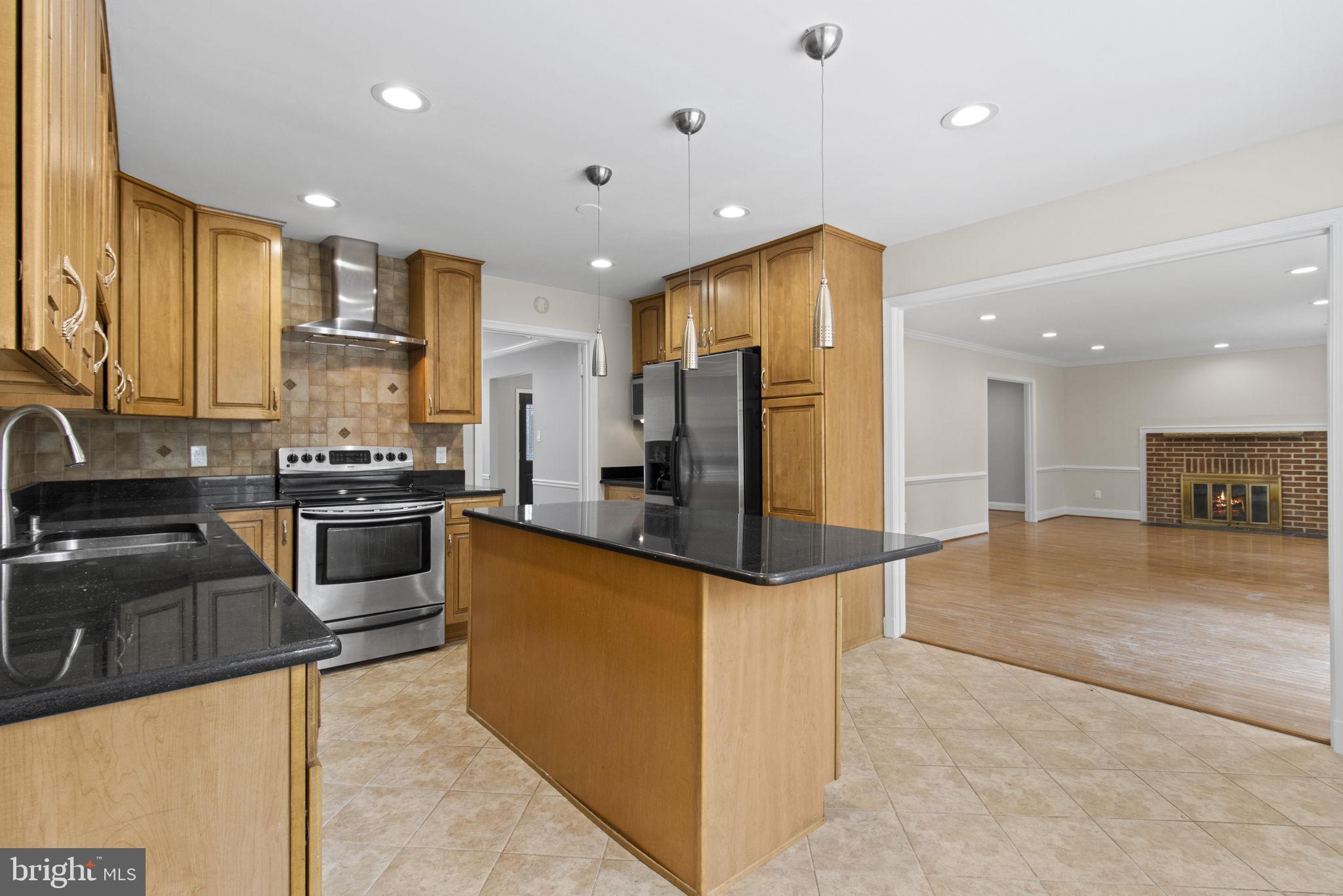 8800 Seven Locks Road Bethesda, MD 20817 - Photo 7 of 33 a kitchen with stainless steel appliances granite countertop a refrigerator a stove and a sink