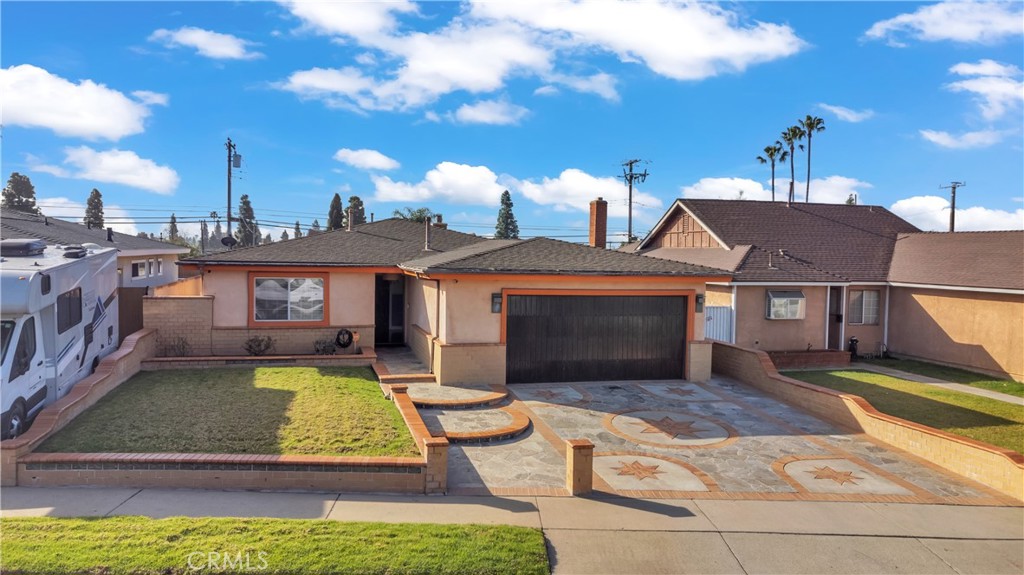 1324 East Turmont Street Carson, CA 90746 - Photo 1 of 47 a view of a house with swimming pool in front of it