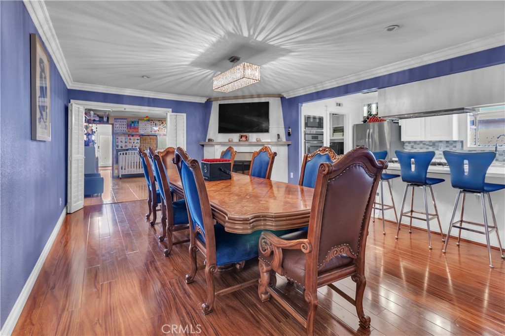 1324 East Turmont Street Carson, CA 90746 - Photo 13 of 47 a view of a dining room with furniture window and wooden floor