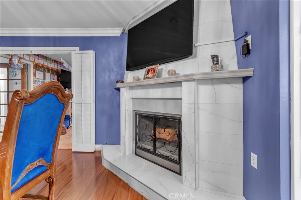 1324 East Turmont Street Carson, CA 90746 - Photo 15 of 47 a living room with furniture and a fireplace