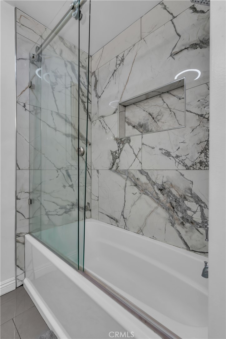 1324 East Turmont Street Carson, CA 90746 - Photo 32 of 47 a bathroom with a bathtub and a shower