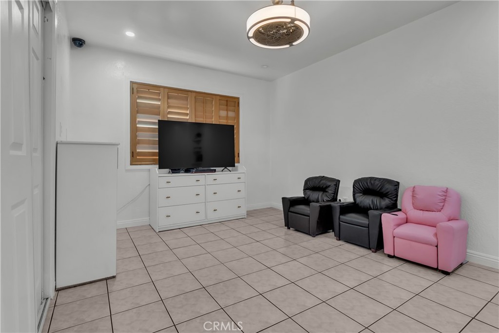 1324 East Turmont Street Carson, CA 90746 - Photo 34 of 47 a living room with furniture and a flat screen tv