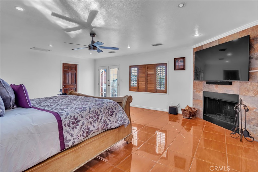 1324 East Turmont Street Carson, CA 90746 - Photo 39 of 47 a bedroom with a bed and a flat screen tv