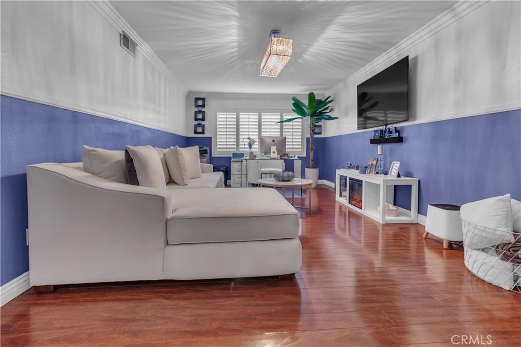 1324 East Turmont Street Carson, CA 90746 - Photo 10 of 47 a living room with furniture wooden floor and a flat screen tv