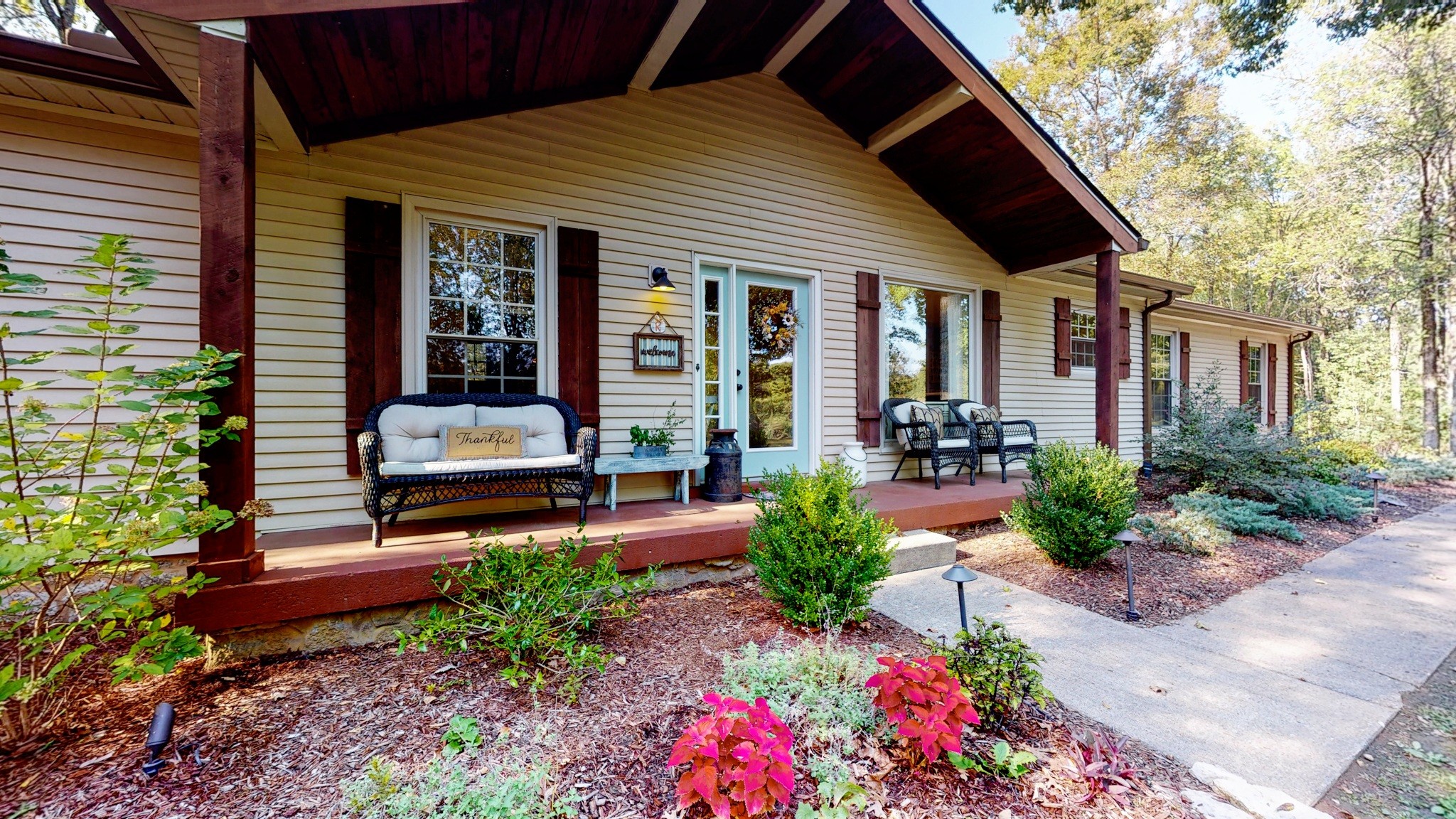 1751 Cooks Road Mount Juliet, TN 37122 - Photo 3 of 36 a front view of a house with porch and garden