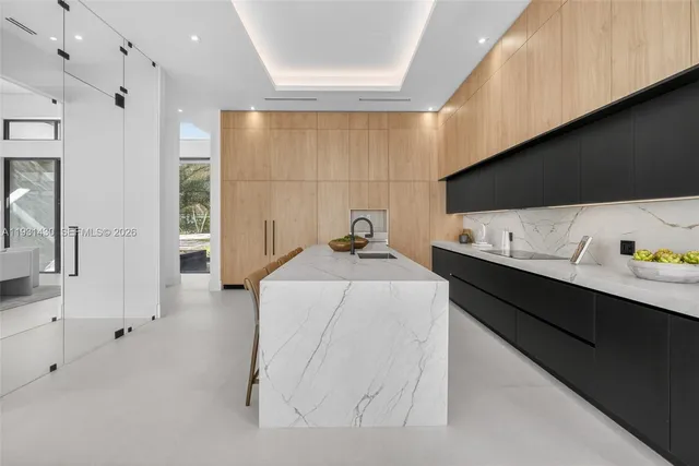 a view of a kitchen with a sink and cabinets
