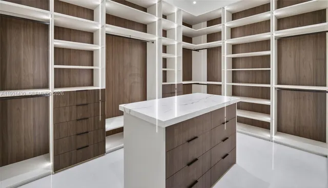 a view of an empty room with empty shelves