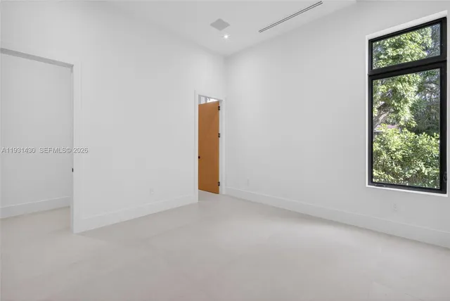 a view of a room with a white walls