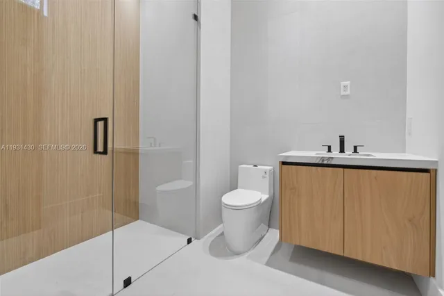 a bathroom with a toilet and a sink