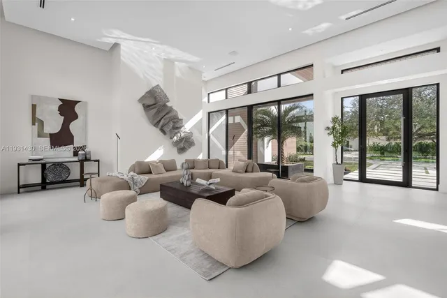 a living room with couch and a large window