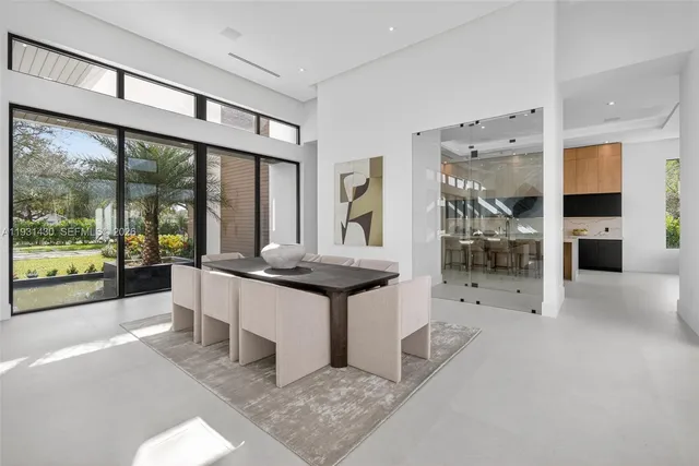 a kitchen with cabinets and chairs