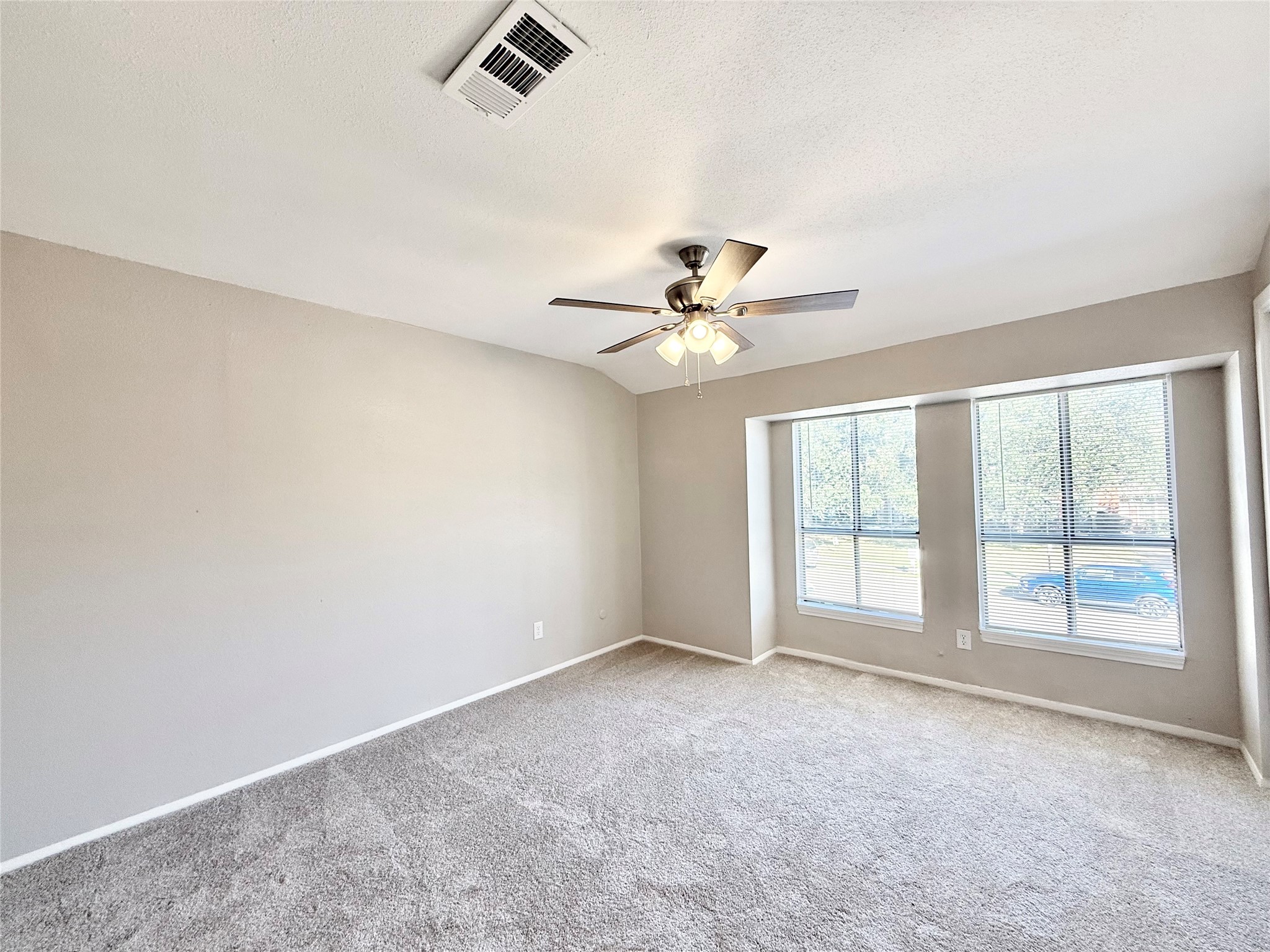 7980 Grove Ridge Drive Houston, TX 77061 - Photo 11 of 19 Primary Bedroom overlooks the front of the unit and has room for a sitting area