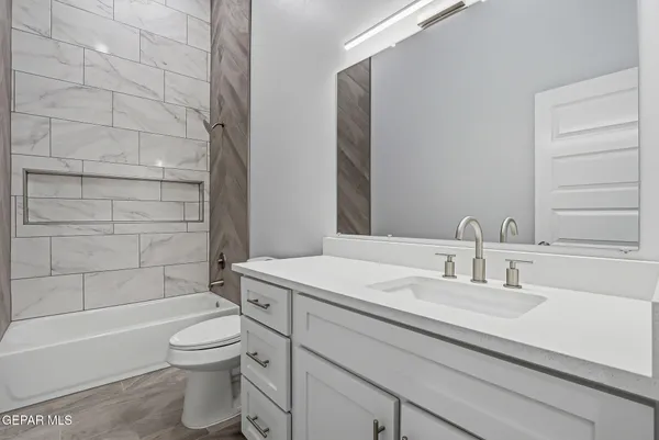 a bathroom with bathtub and shower