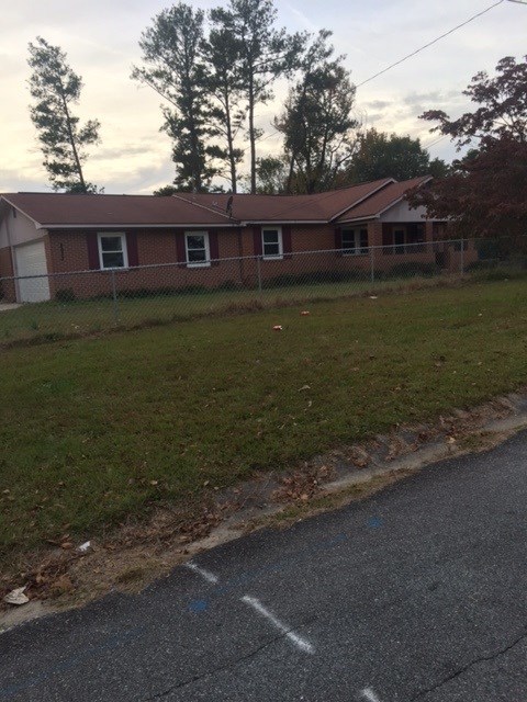 4623 Massey Road Macon, GA 31206 - Photo 1 of 8 a view of a house with a yard
