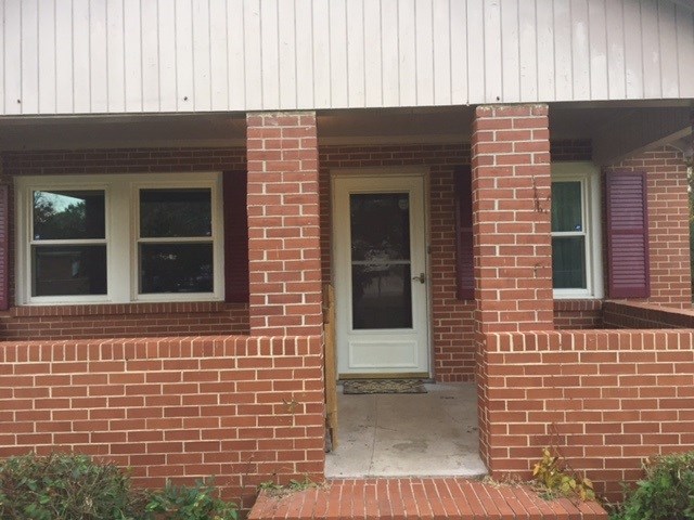 4623 Massey Road Macon, GA 31206 - Photo 3 of 8 a front view of a house with a window