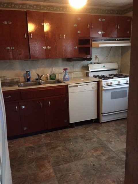 4623 Massey Road Macon, GA 31206 - Photo 4 of 8 a kitchen with a stove and a cabinets