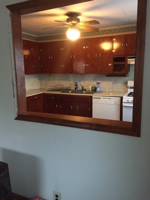 4623 Massey Road Macon, GA 31206 - Photo 5 of 8 a kitchen with stainless steel appliances granite countertop a sink and cabinets