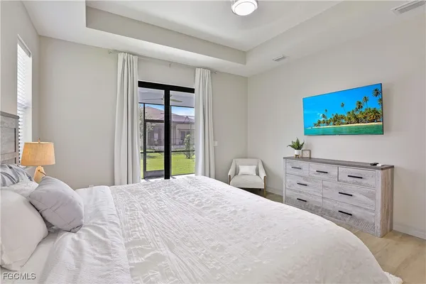 a bedroom with a bed and a dresser