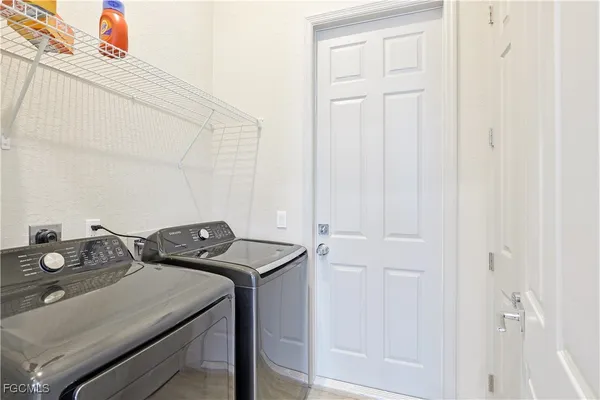 a utility room with dryer and washer