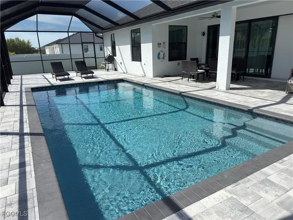 a view of a swimming pool with a patio