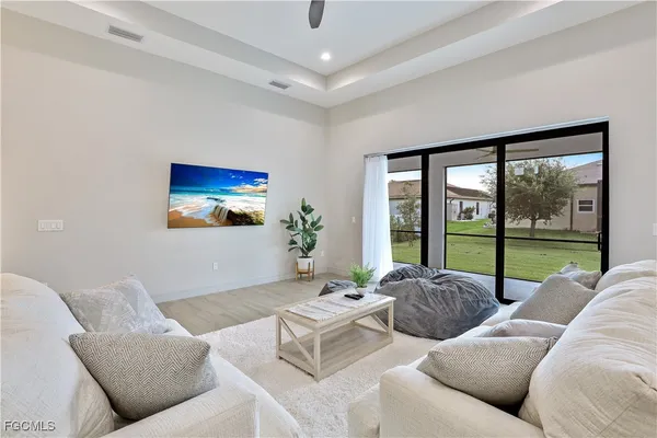 a living room with furniture and a large window
