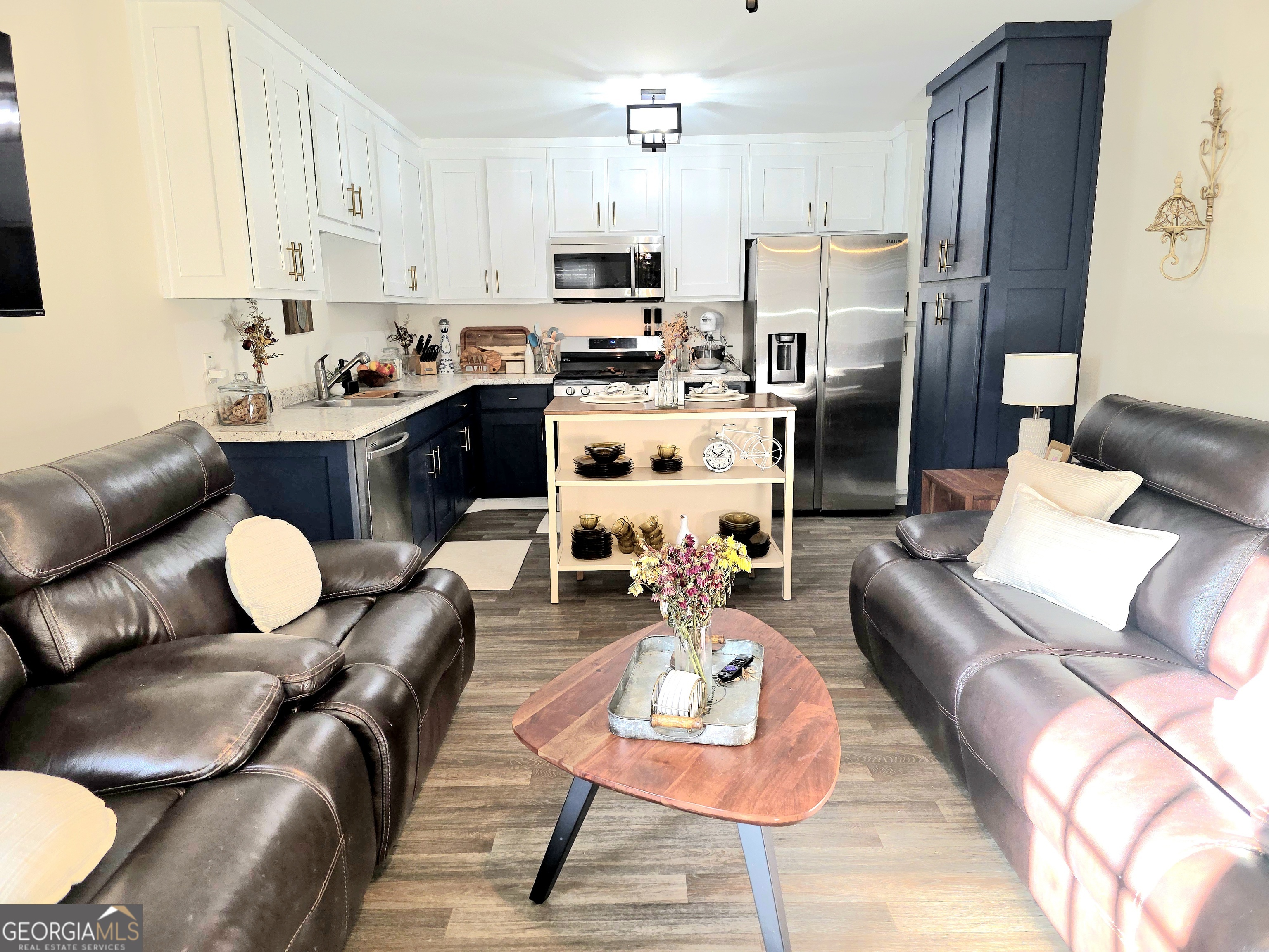 3060 Eatonton Road Madison, GA 30650 - Photo 55 of 65 a living room with furniture kitchen and a refrigerator