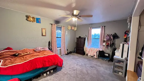 a bedroom with a bed and a walk in closet