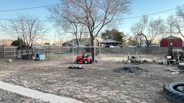 a view of a yard with a patio