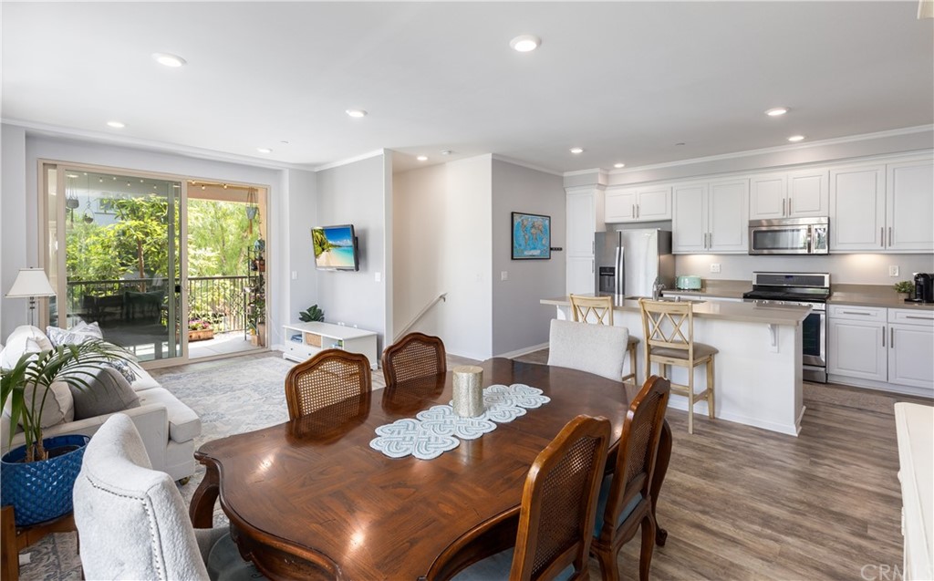 75 Plateau Irvine, CA 92618 - Photo 11 of 29 a kitchen with a dining table chairs and granite counter tops