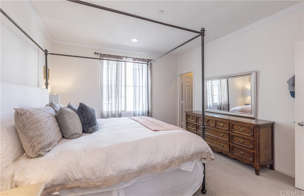 75 Plateau Irvine, CA 92618 - Photo 13 of 29 a bedroom with a bed a dresser and a window